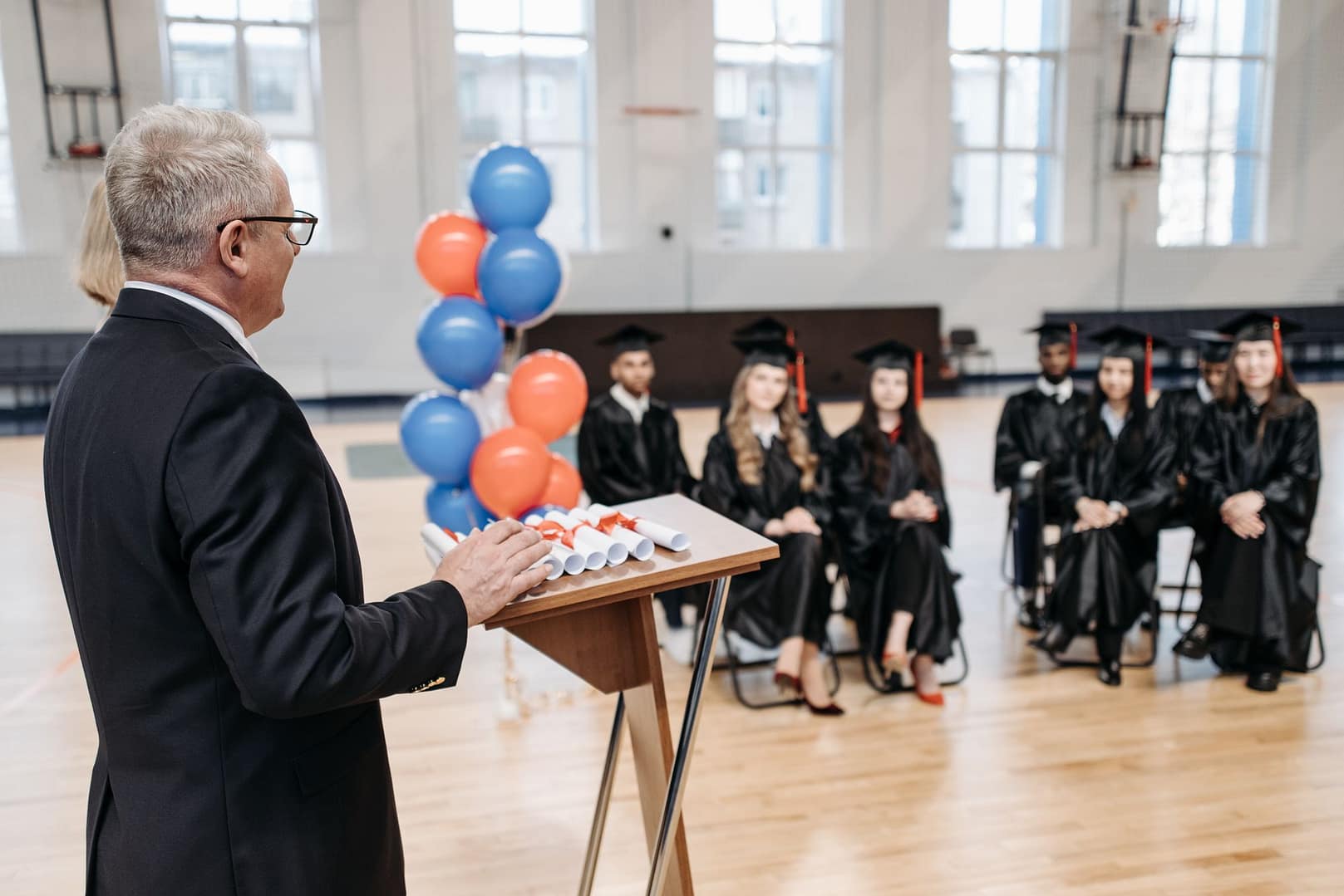 Speaker addressing students at a school ceremony
