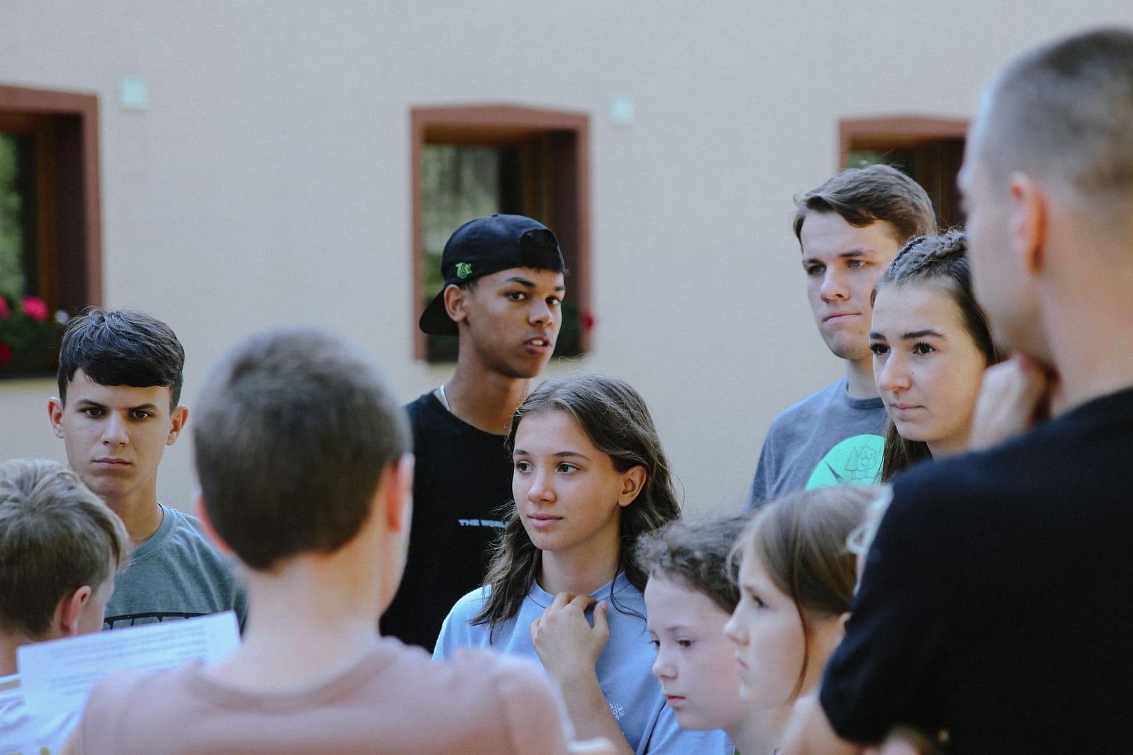 Group of teenagers talking together outdoors