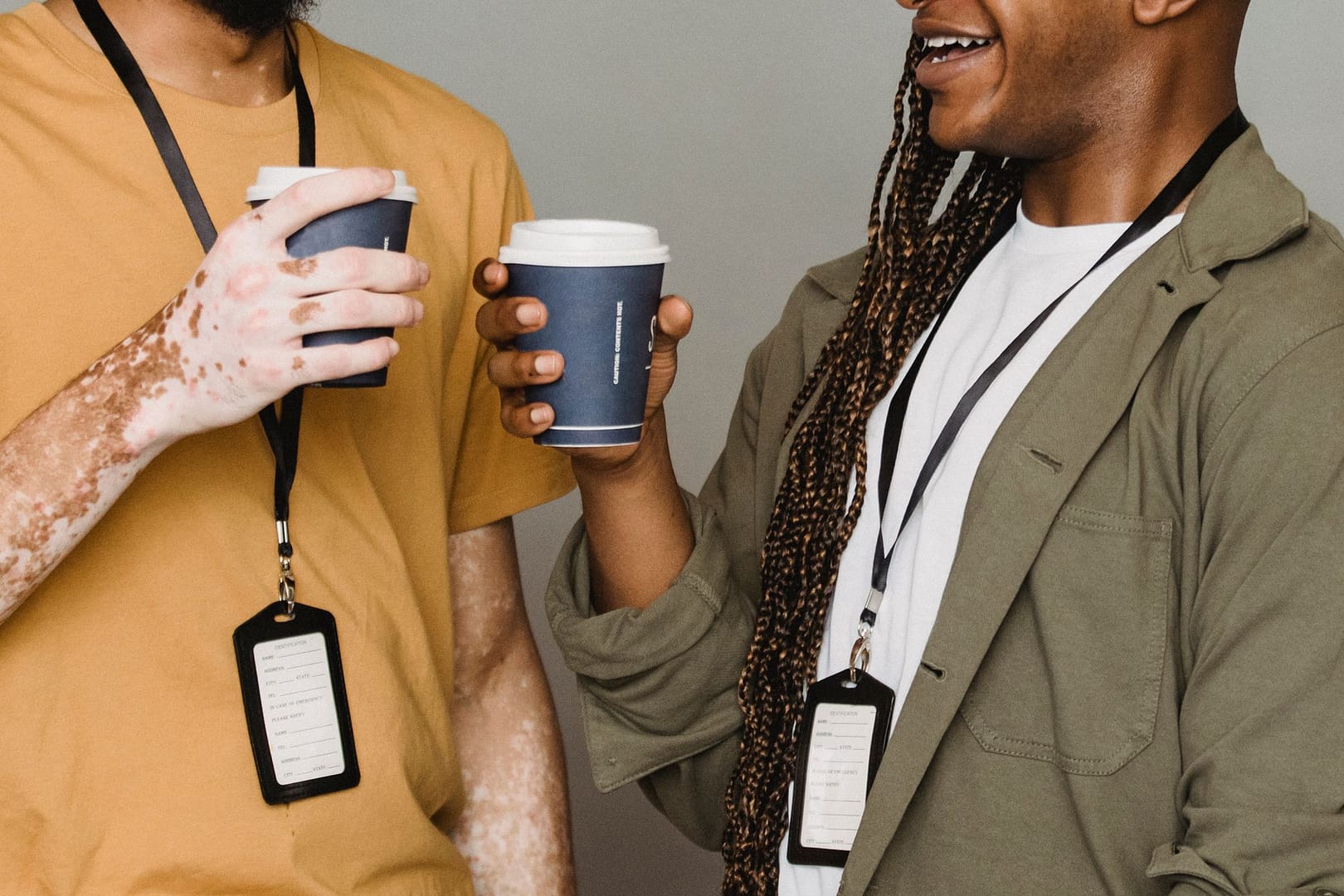 Two people talking over coffee during a coaching session