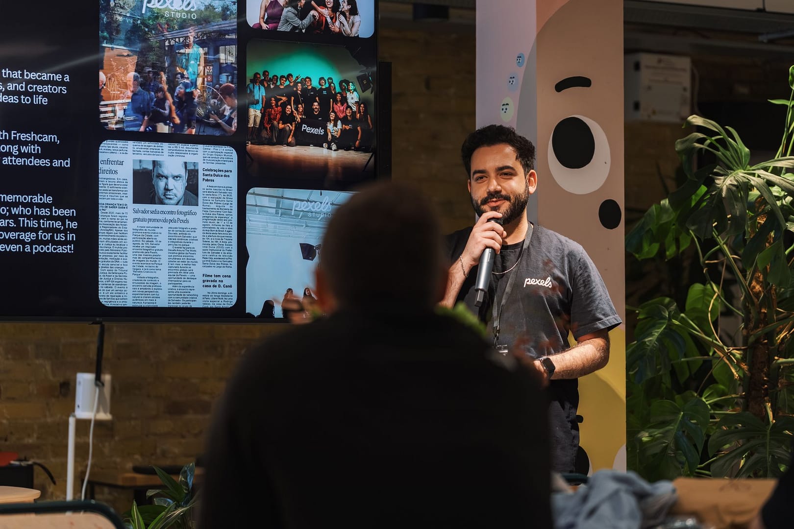Guest speaker presenting to an audience at an indoor event